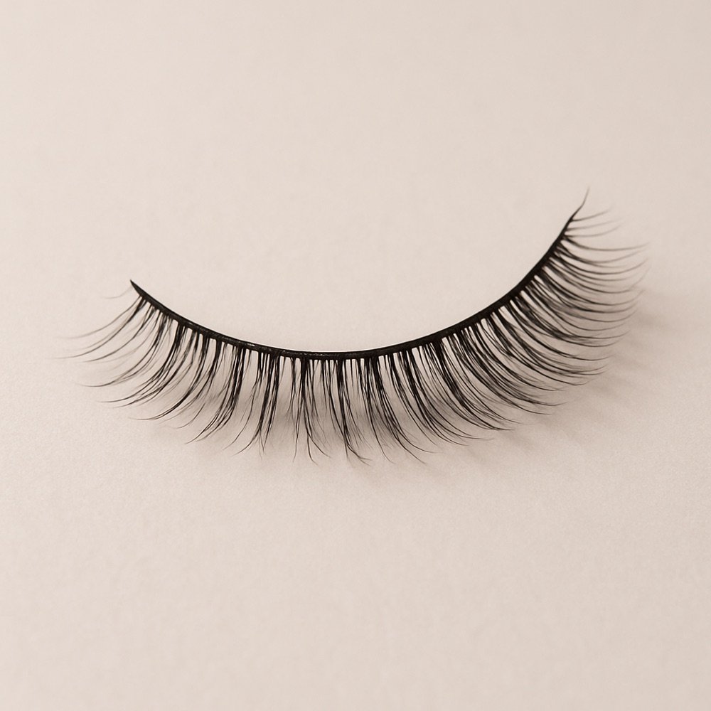 AI-generated editorial photograph of a graduated-length false eyelash strip
